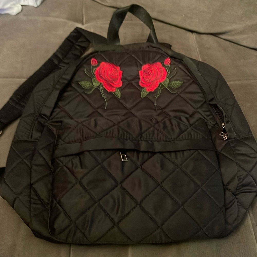 Black backpack with red roses, never used. Bundle 4 a deal.